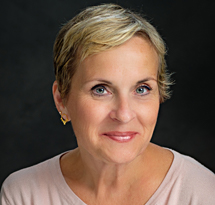 Profile photo of Rachel Wrenn, against a dark background